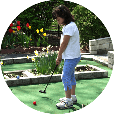 Guest Lines Up A Shot On Mini Golf Course