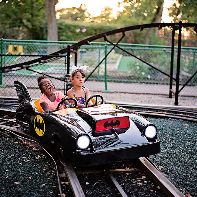 Two young girls on the Electric Cars ride