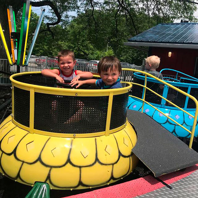 Two young boys on the Memphis Kiddie Park Turtle Ride